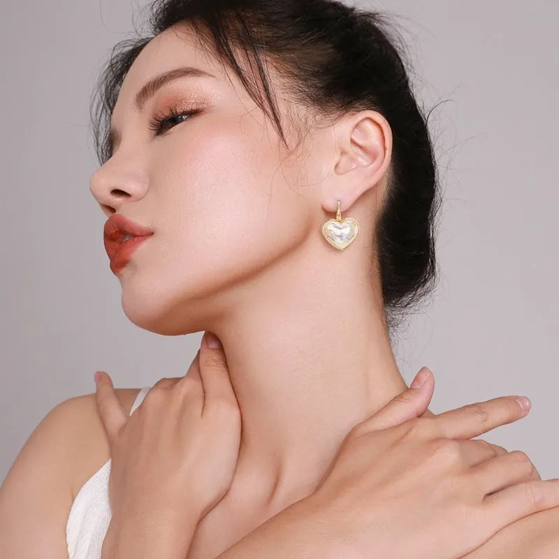 Gold tone alloy ear clips for women with clip-on design and natural styling
