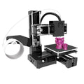 K9 New Mini desktop 3D printer in black or blue colour on a workspace.