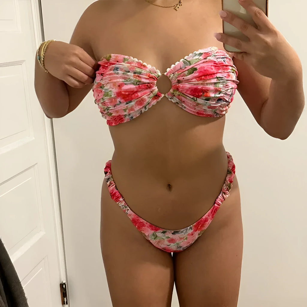 Blue floral print tube top bikini set with lace trim on a mannequin.