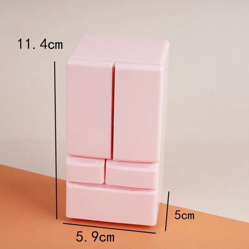 White miniature candy toy plastic model with illuminated feature on display.