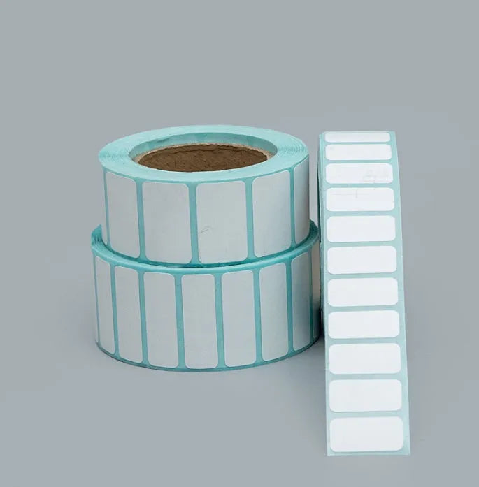 Roll of waterproof black and blue sticky sticker labels 20mm x 10mm 3000 sheets double row horizontal layout on table