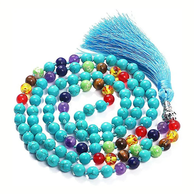 Long agate tassel necklace with geometric stone beads in various colours on a neutral background.