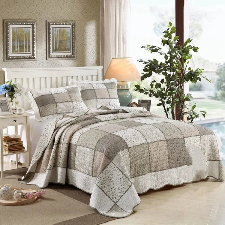 Pure cotton quilted bedspread and pillowcase set in a chosen pattern, laid flat on a bed.