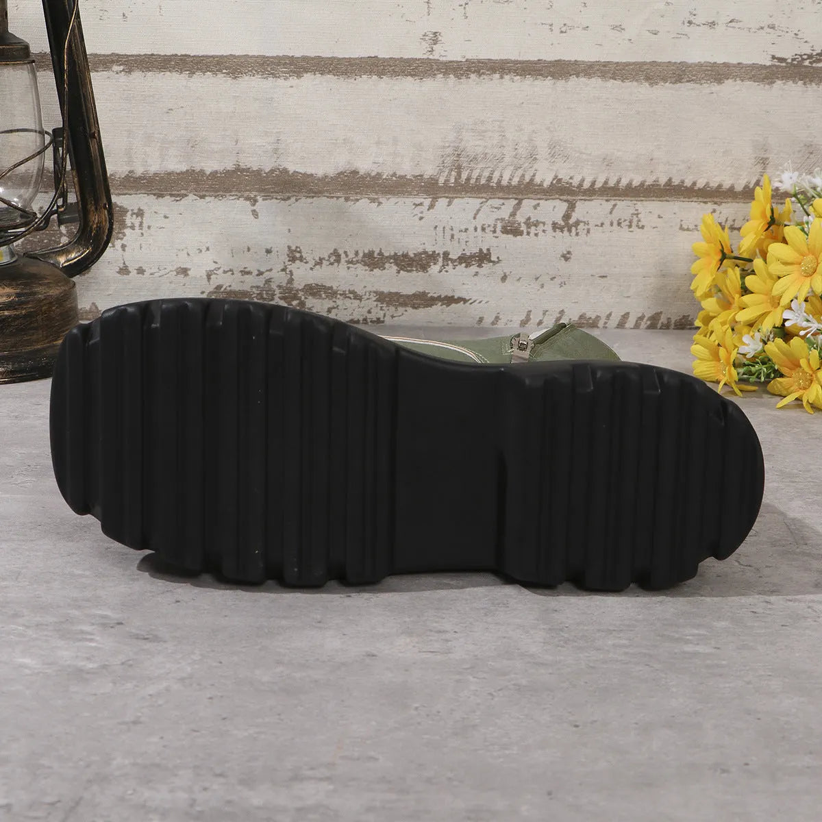 Women's black retro platform boots with patchwork round toe and side zip.