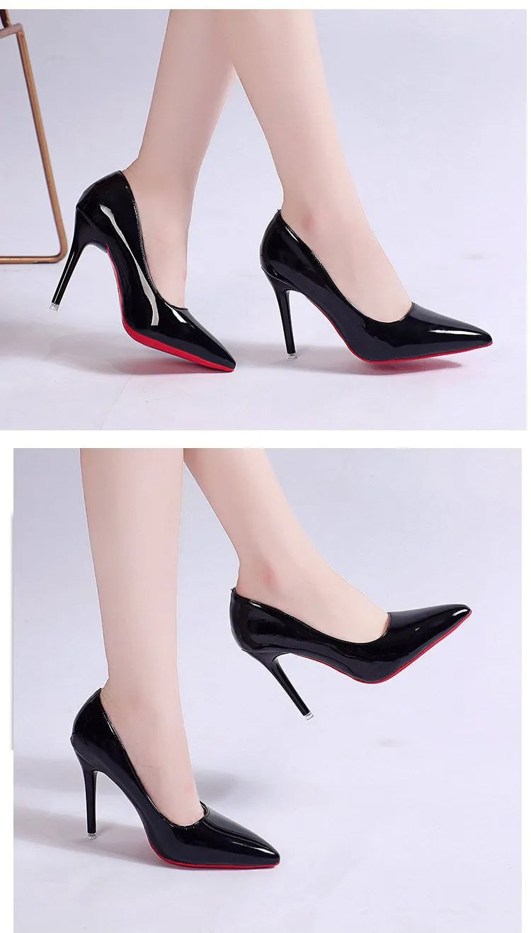 Women's black pointed toe stiletto heel pumps with a shallow mouth design on a plain background.