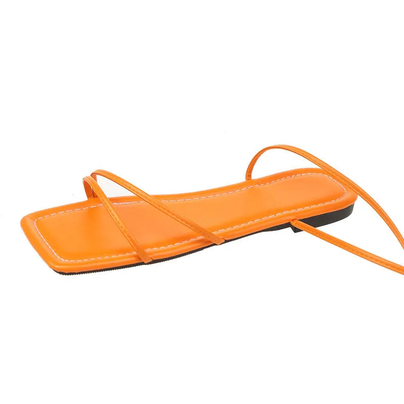 Women's flat sandals with ankle ring bandage cloth detail and front lace-up fastening in solid colour