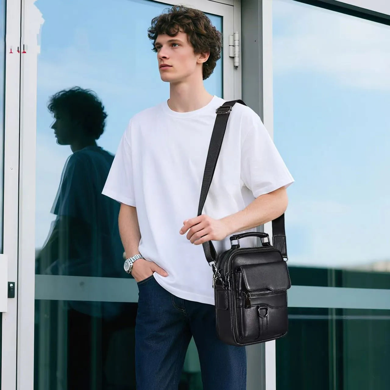 Black genuine first layer cowhide leather messenger bag measuring 19x8x24cm with slung strap
