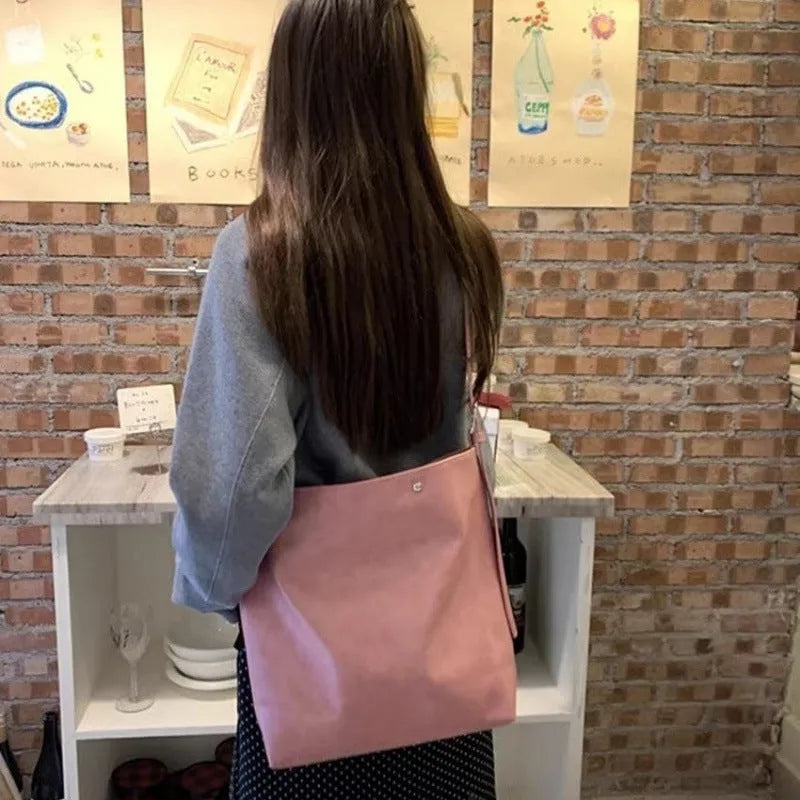 Corduroy one-shoulder commuter bag in pink or brown with PU lining, showing dimensions
