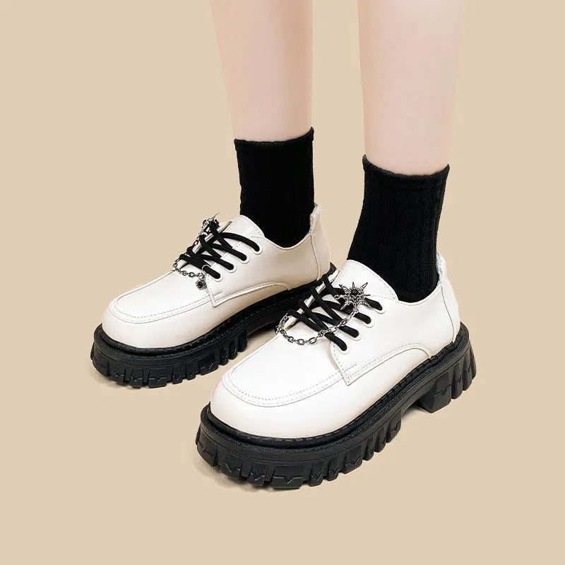 Women's preppy college loafers in Duke Asterism colour with cross shoulder straps and round toe design