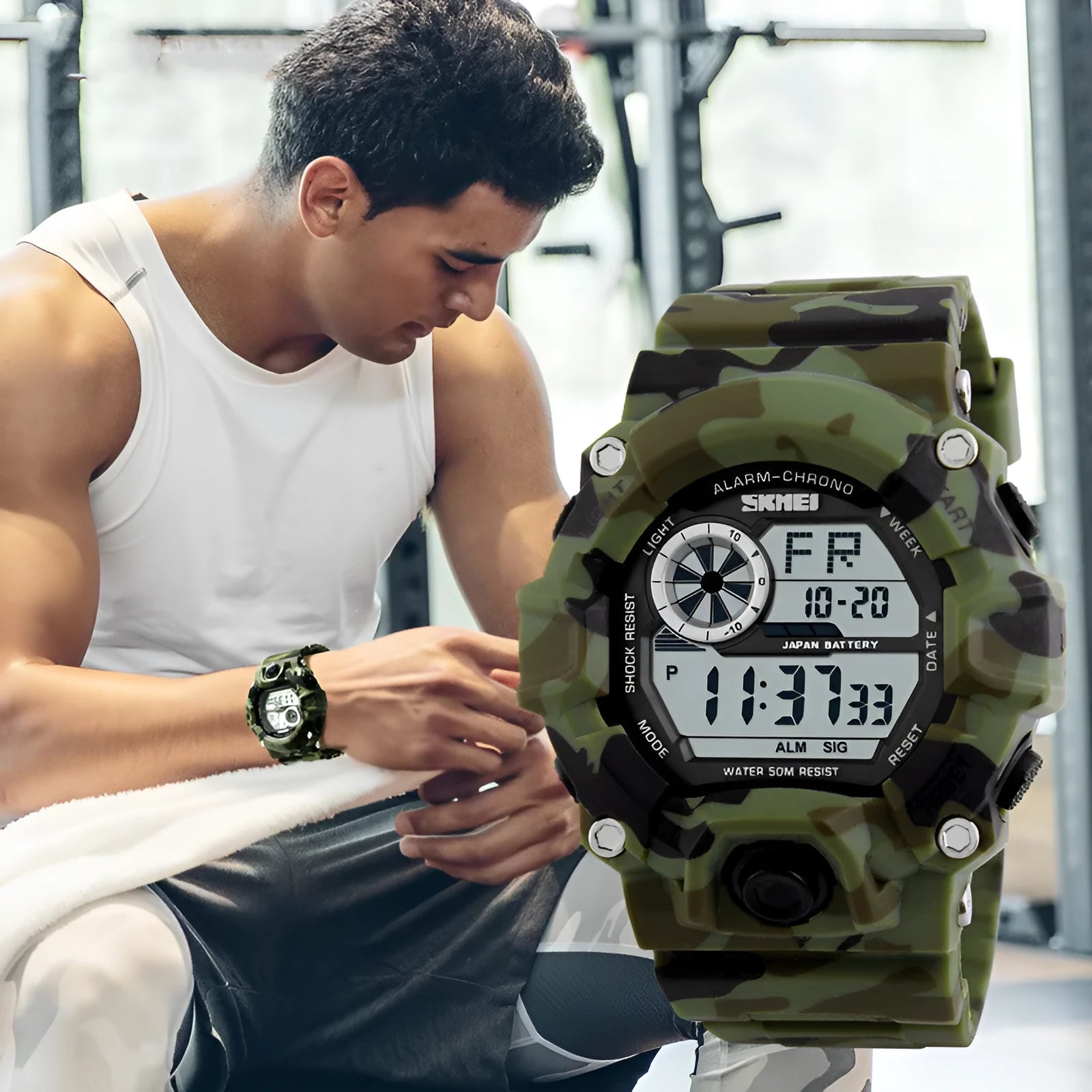 Waterproof electronic sports watch with round dial and plastic strap in camouflage green colour