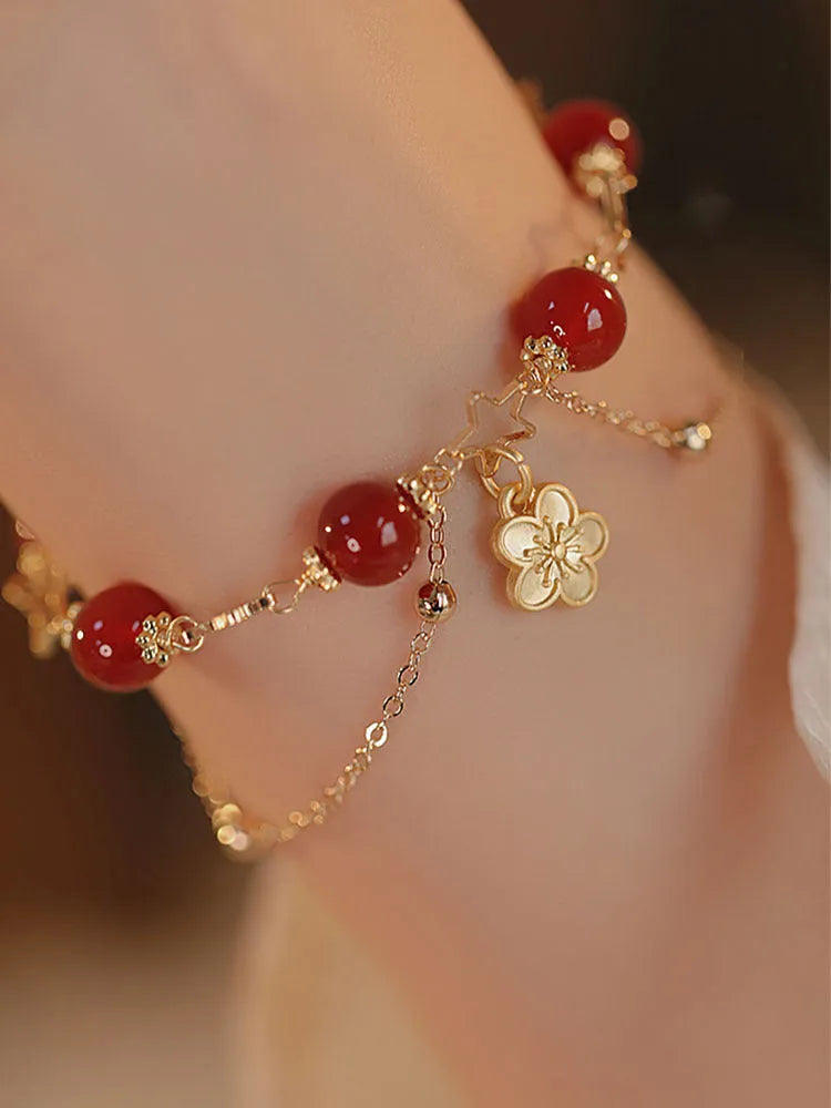 Red agate double layer women's bracelet with floral and peach blossom designs on natural stone