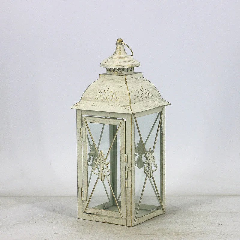 European black and white wrought iron floor-standing storm lantern with tempered glass in three sizes for courtyard decoration.
