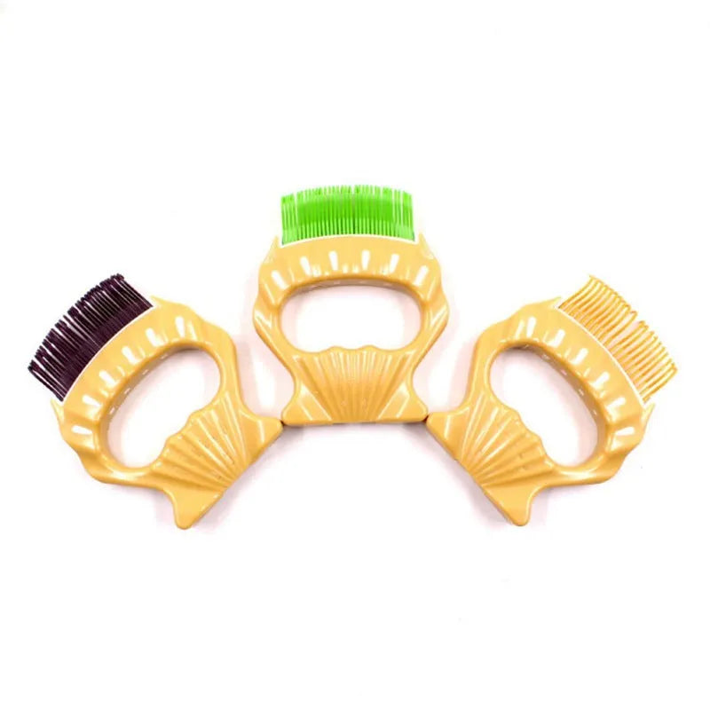 Shell-shaped plastic pet grooming comb with bent wire bristles and anti-slip handle in assorted colours.