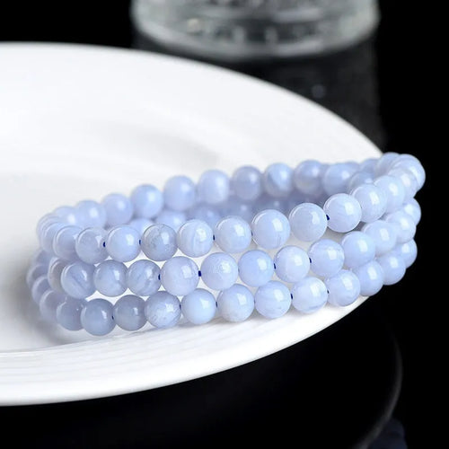 Blue agate bracelet with natural striped patterns on 6-6.8 mm beads in unisex design