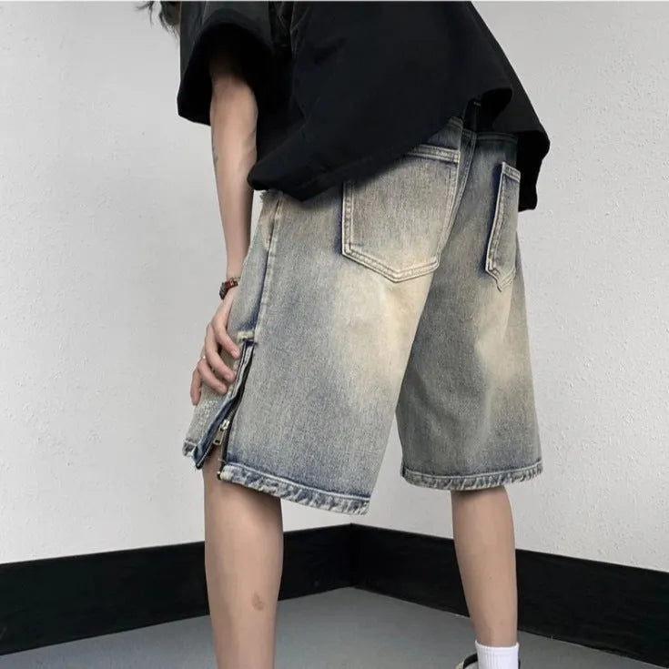 Blue denim shorts with wide leg cut and tattered retro detailing