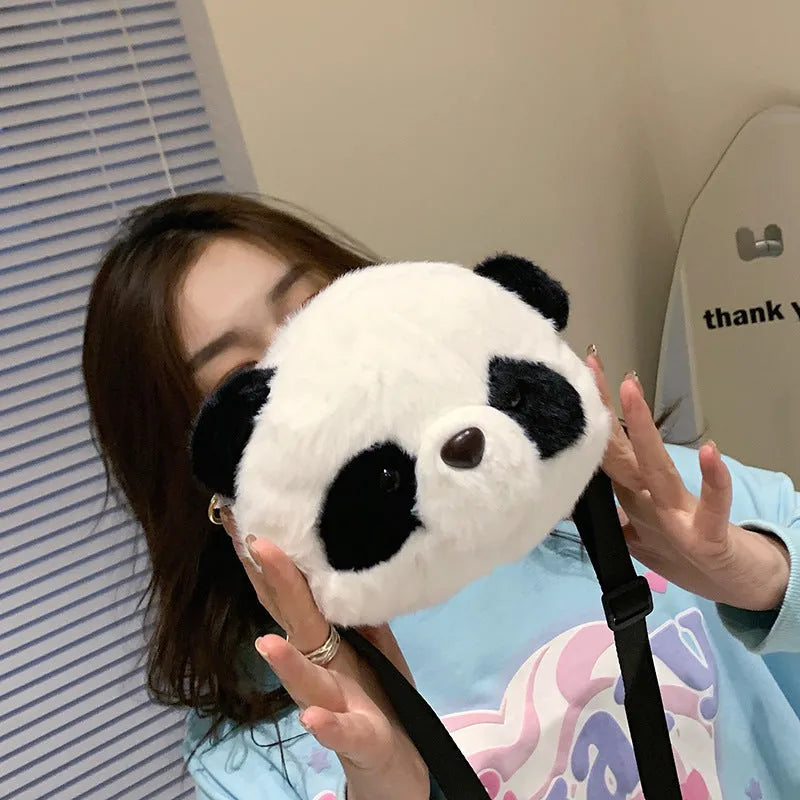 Plush panda head crossbody bag with cylindrical shape measuring 18cm wide