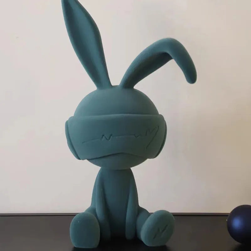 Blue resin rabbit table ornament with suede blindfold decorative detail
