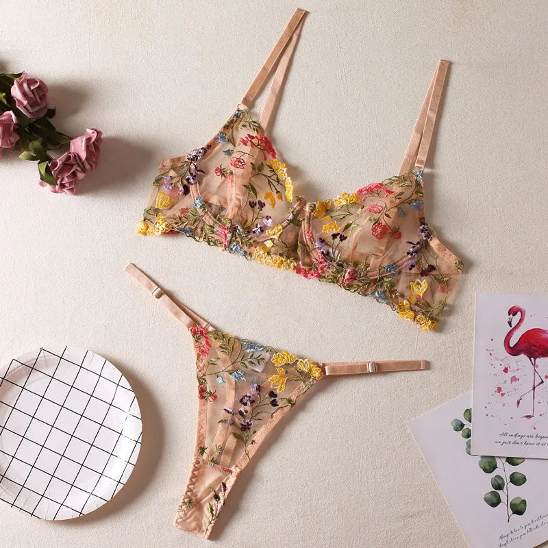 Floral patterned mesh bra with steel ring detail on T-back strap, shown in skin colour.