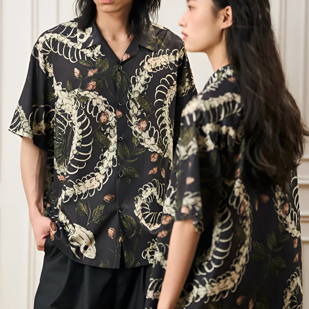 Short sleeve loose fit shirt with snake bone and floral pattern print and a Cuban collar.
