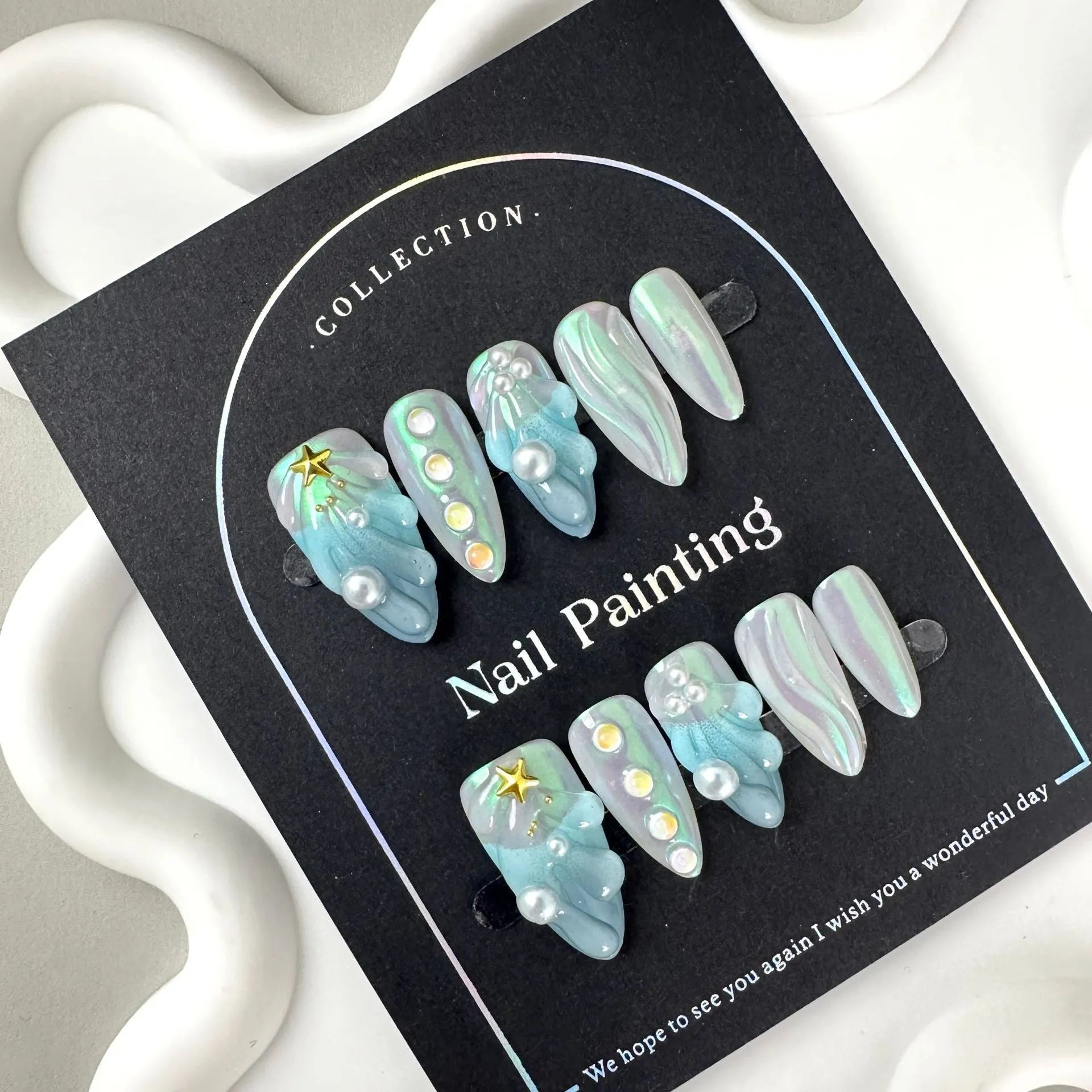 Blue plastic HAILANG shell nail stickers in XS S M L sizes for summer manicures