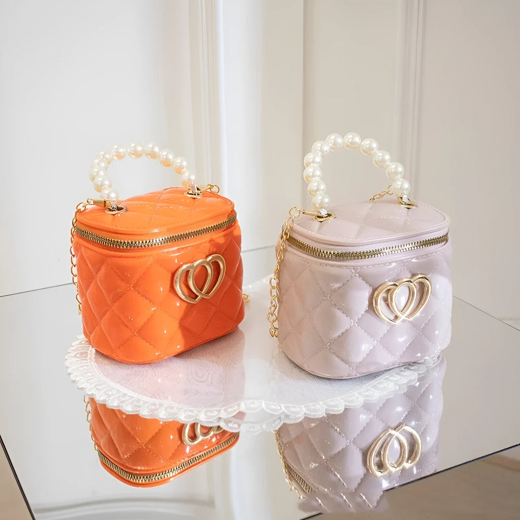 PVC bucket-style gel bag for women with a heart pattern, shown in multiple colour options.