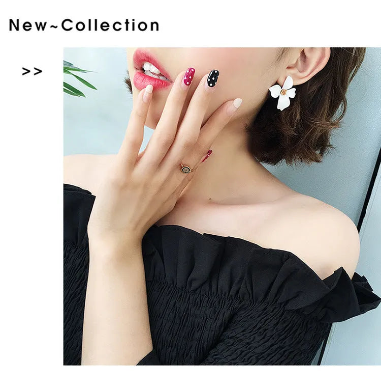 Women's flower stud earrings with electroplated pink or white finish on alloy construction