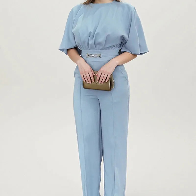 Blue men's casual polyester suit set with trousers and a long-sleeved shirt on a mannequin