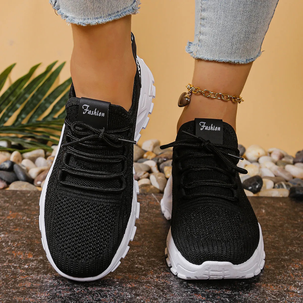 Women's low-top mesh sports sneakers in beige with front lace-up and a subtle platform sole.