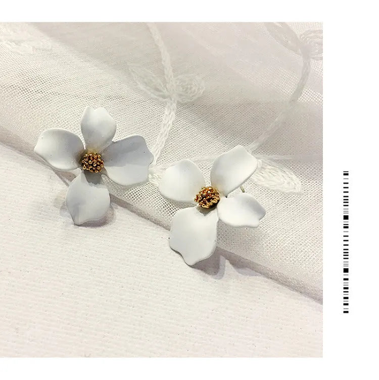 Women's flower stud earrings with electroplated pink or white finish on alloy construction
