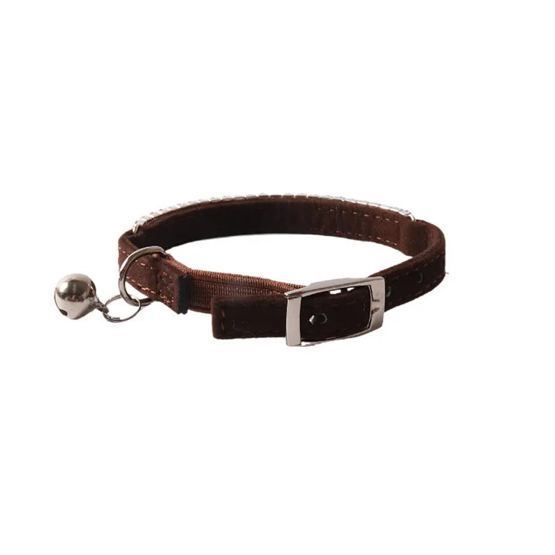 Colourful flocking fabric cat collar with elastic buckle shown in pink, black, and blue options