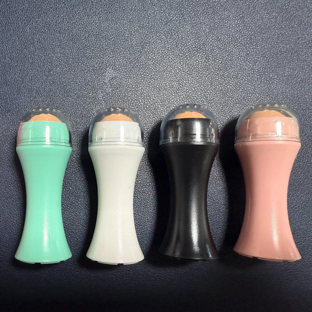 Volcanic stone facial roller for oily skin control in black, green, pink, or white colours.