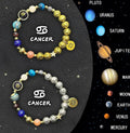 Two natural stone beaded bracelets on a surface, representing zodiac signs from the complete twelve-sign set.