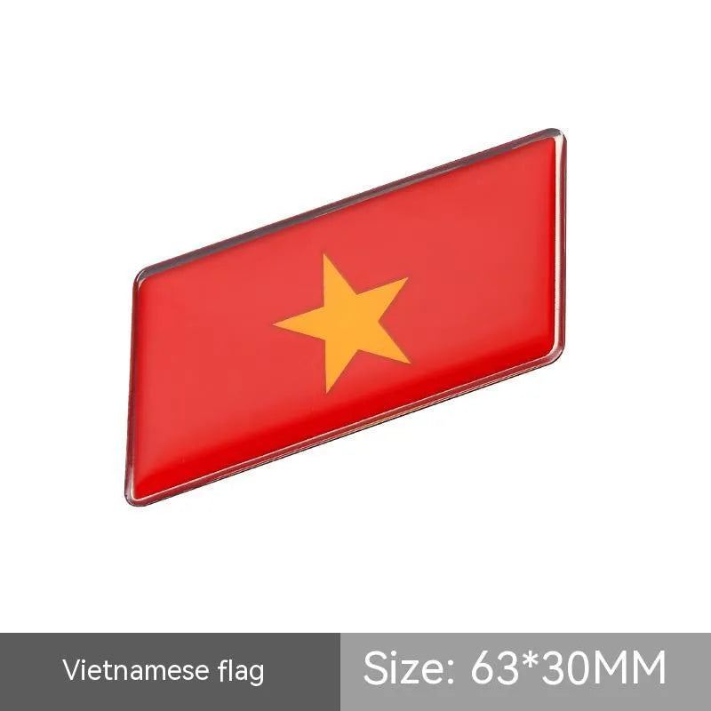 Aluminium metal car sticker with national flag design in a parallelogram shape.