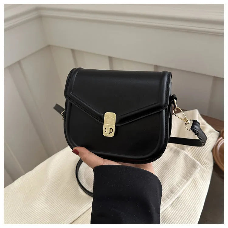 Soft textured PU leather messenger bag with clamshell opening, shown in a horizontal square shape.
