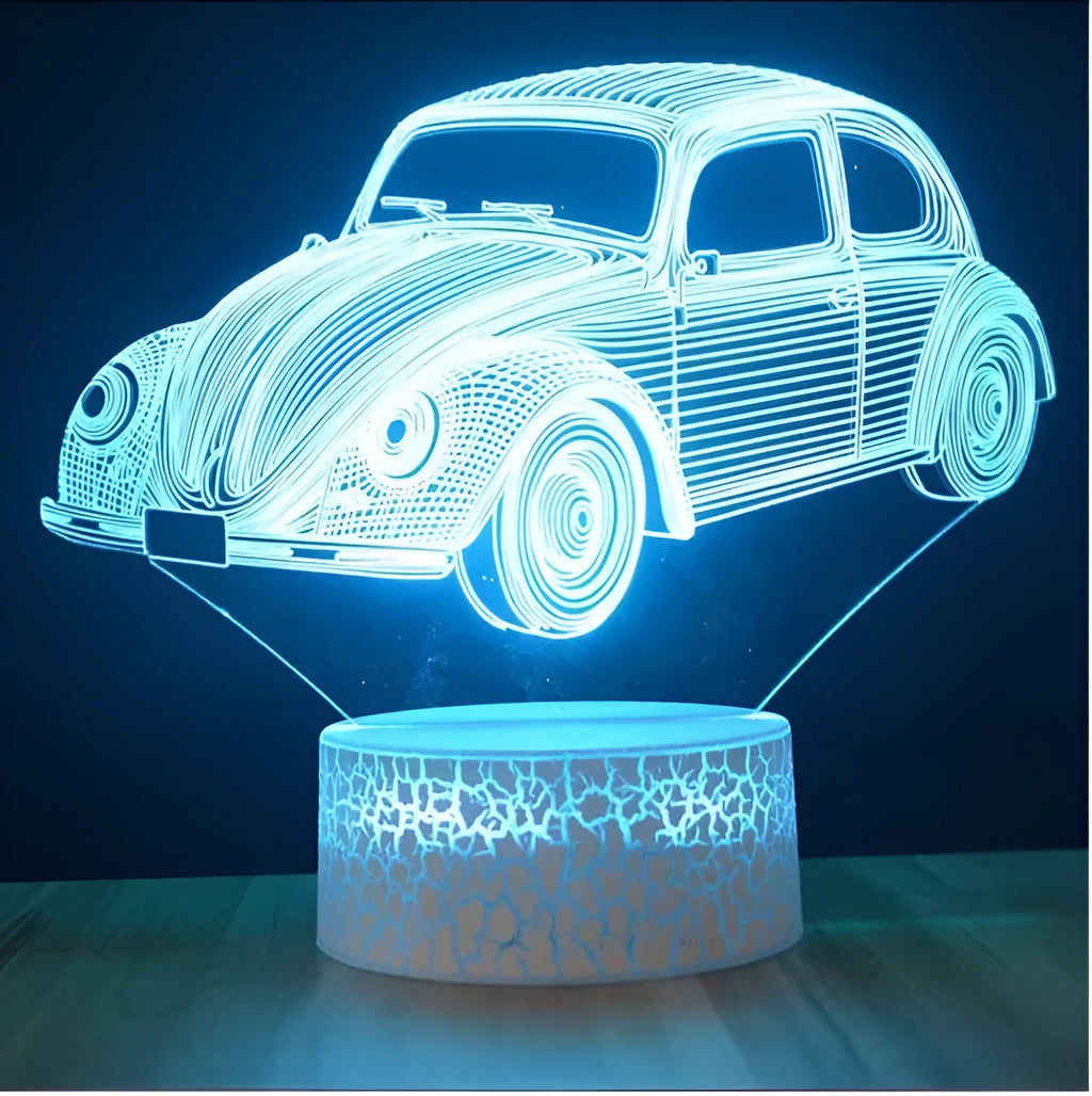 Small 3D LED table lamp with colourful acrylic shade and remote control on wooden desk