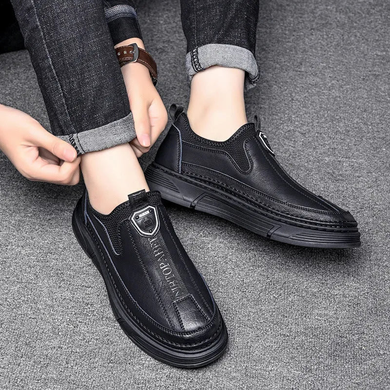 Men's black leather casual shoes with a round toe on a white background.