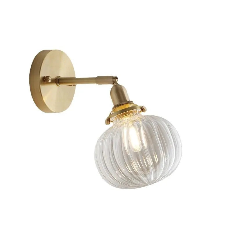 Pumpkin-shaped glass wall lamp in a choice of blue, clear, or water ripple transparent finish.