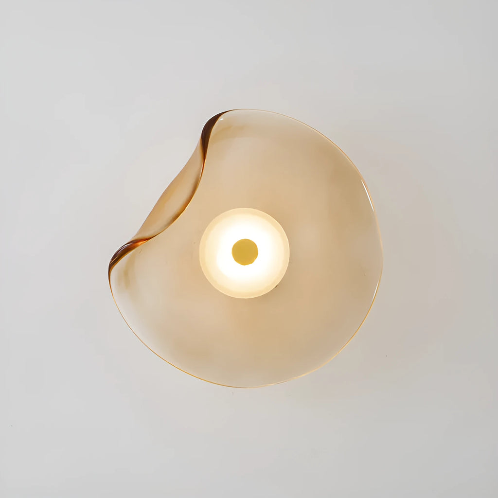 Round glass wall lamp for bedroom bedside in cognac, grey or light colour finishes.