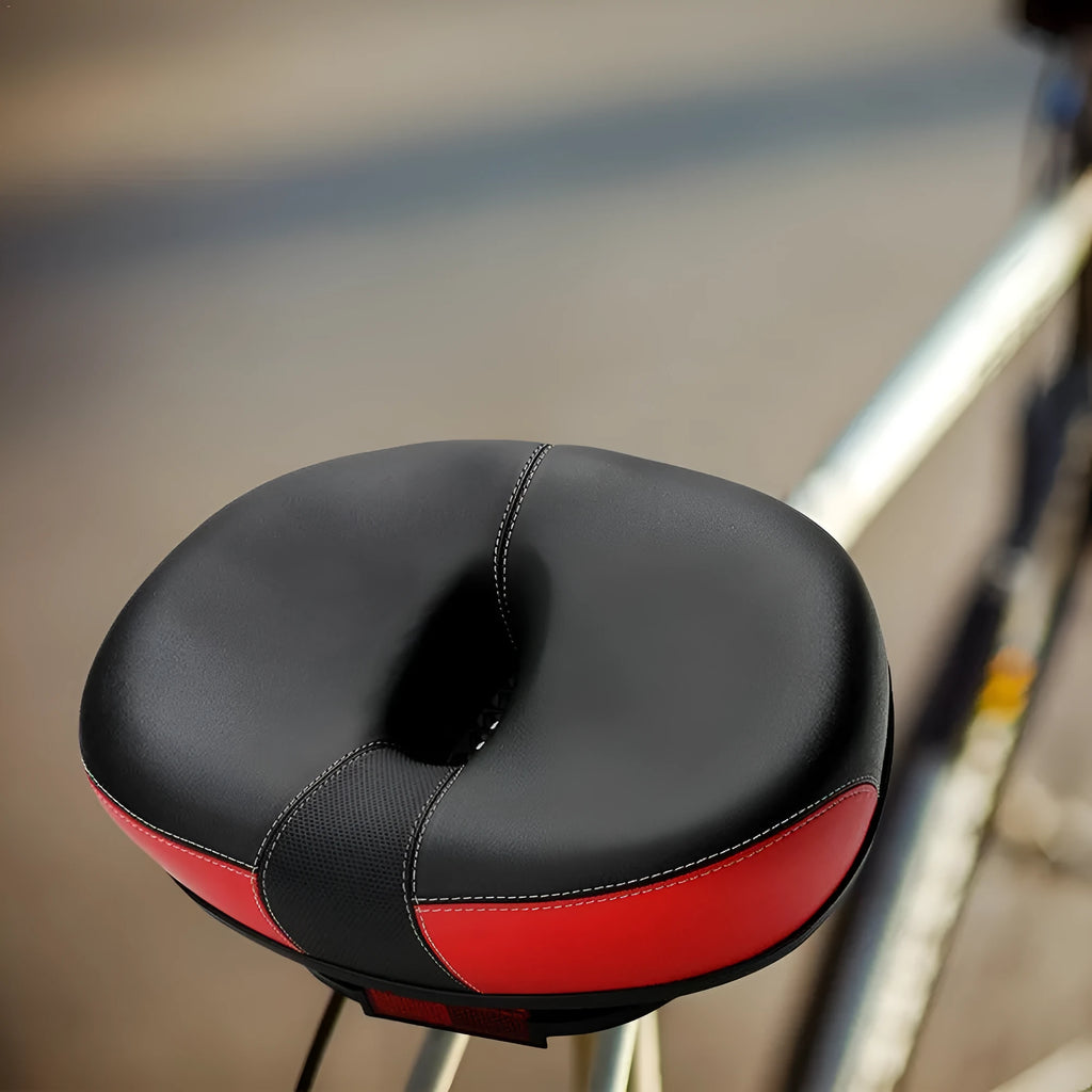 Large red thickened bicycle saddle with shock absorber and reflective sticker, dimensions 210x270mm.