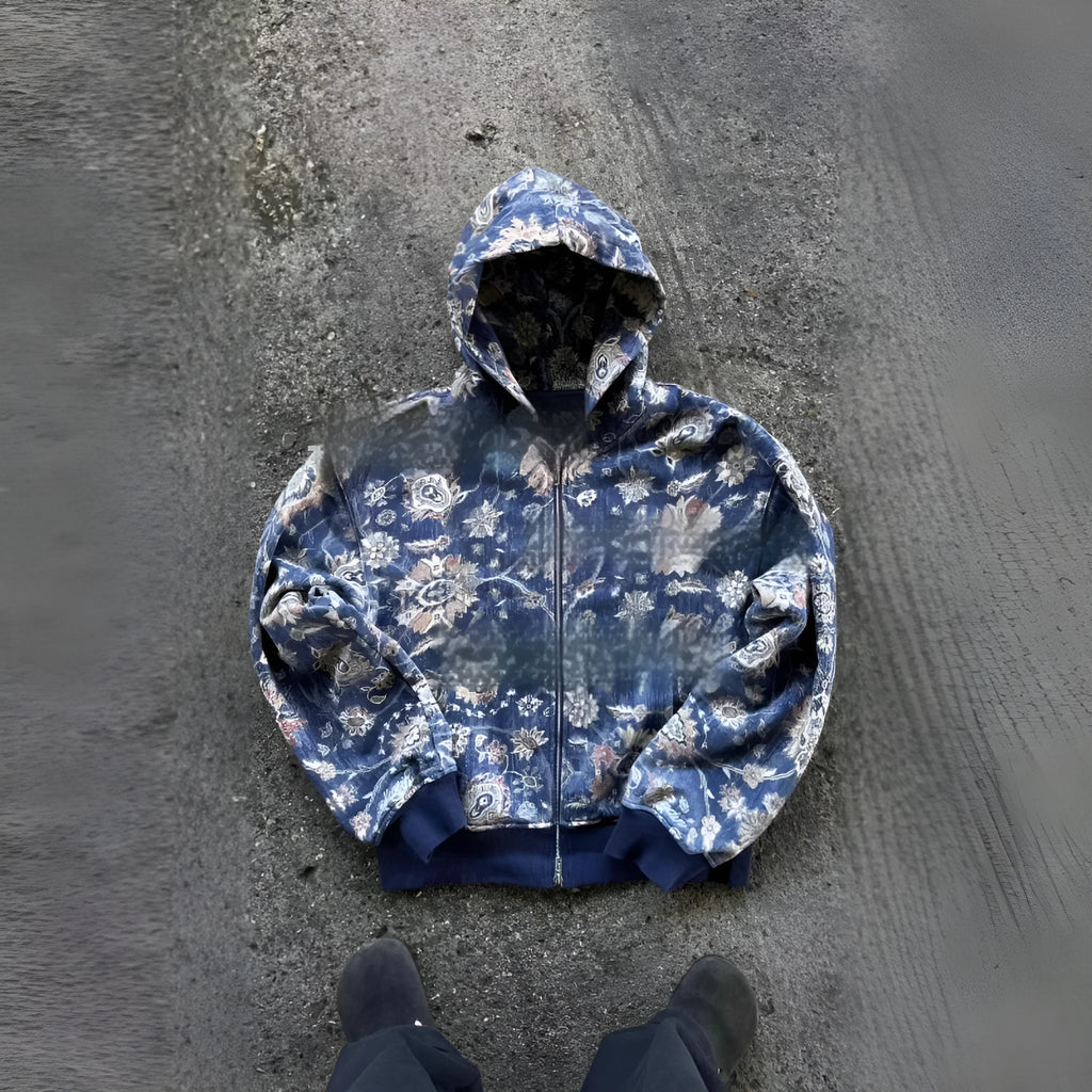 Men's blue hooded loose zip coat with digital printing shown with long sleeves and casual styling