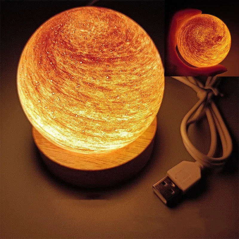 Compact modern planet USB night light on its base with dimmable three-colour lighting.
