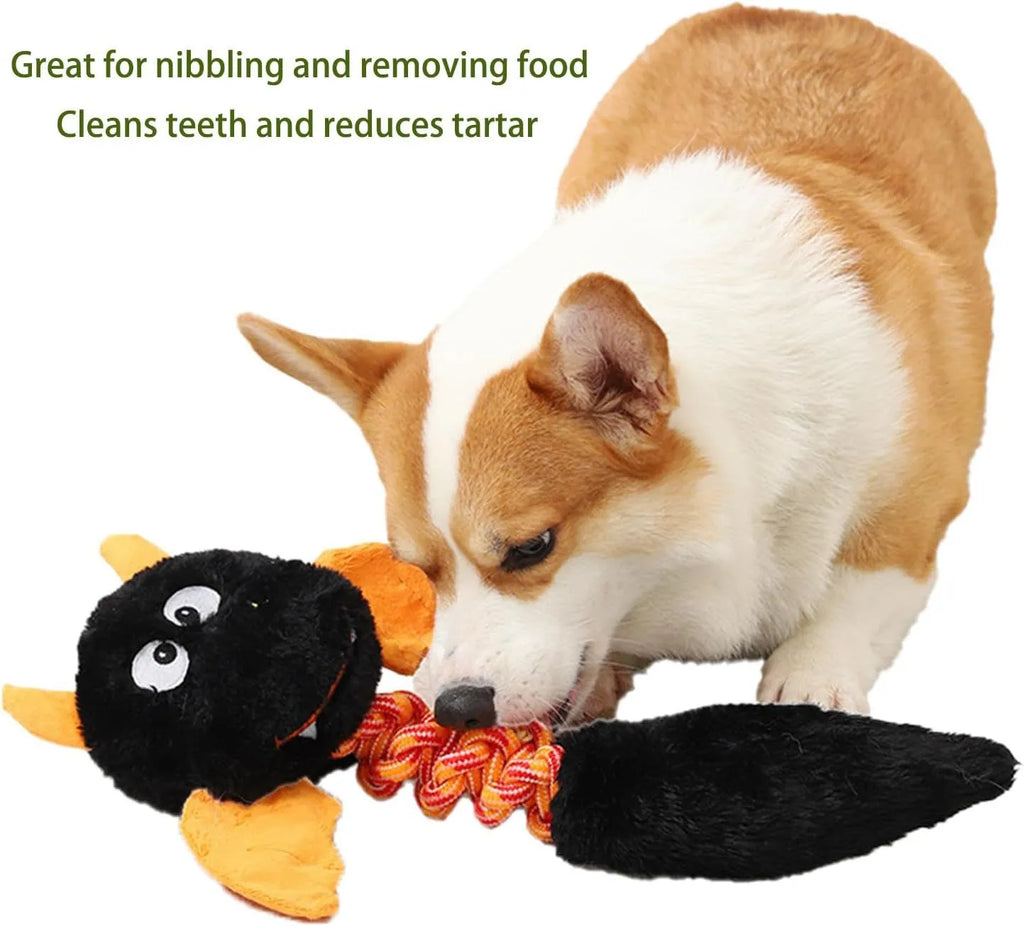 Large plush dog toy in red with cartoon design, featuring a rope knot and suitable for aggressive chewers