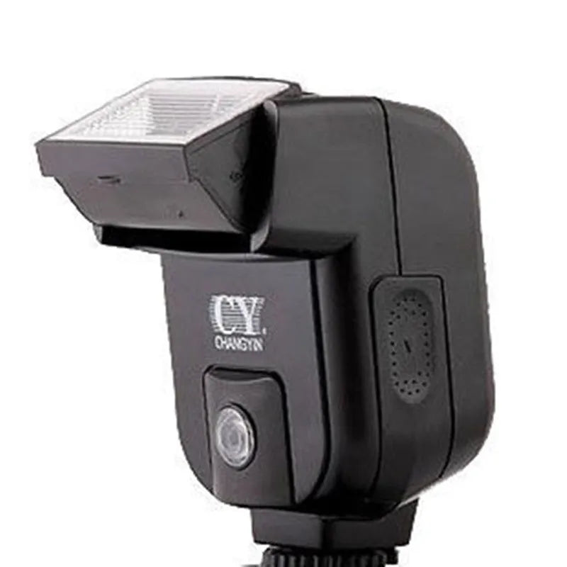 Compact black SLR camera flash unit shown tilted upwards on a hotshoe, illustrating its 90-degree bounce flash capability.