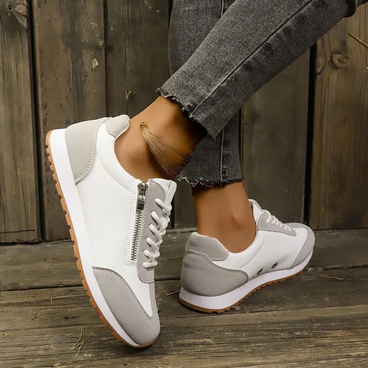 Women's flat-heeled shoes in champagne, grey, and white colours showing lightweight artificial PU uppers and rubber soles