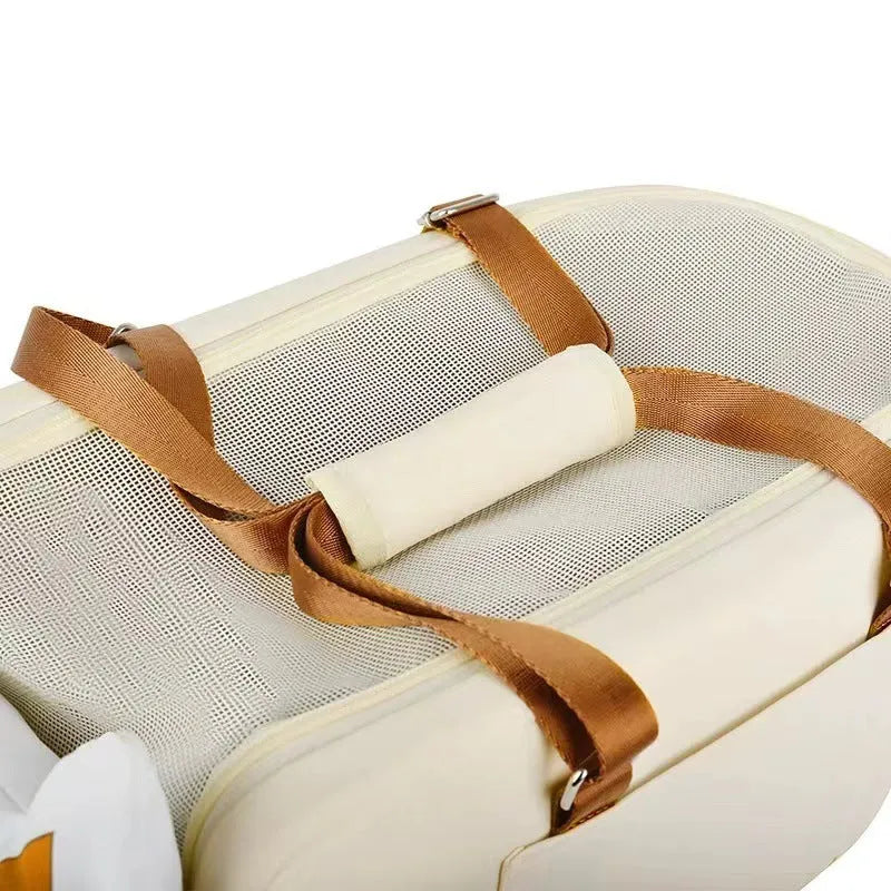 Hard-sided beige pet carrier with one shoulder strap, dimensions 43x25x22.5cm for pets to 15kg
