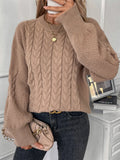 Women's beige loose round neck casual polyester sweater on a hanger.