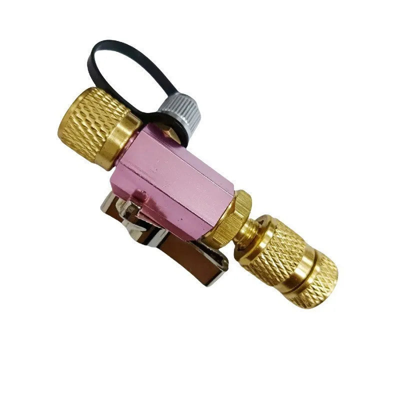 Metal valve core disassembly tool set showing black and pink valve removers and a valve core wrench.