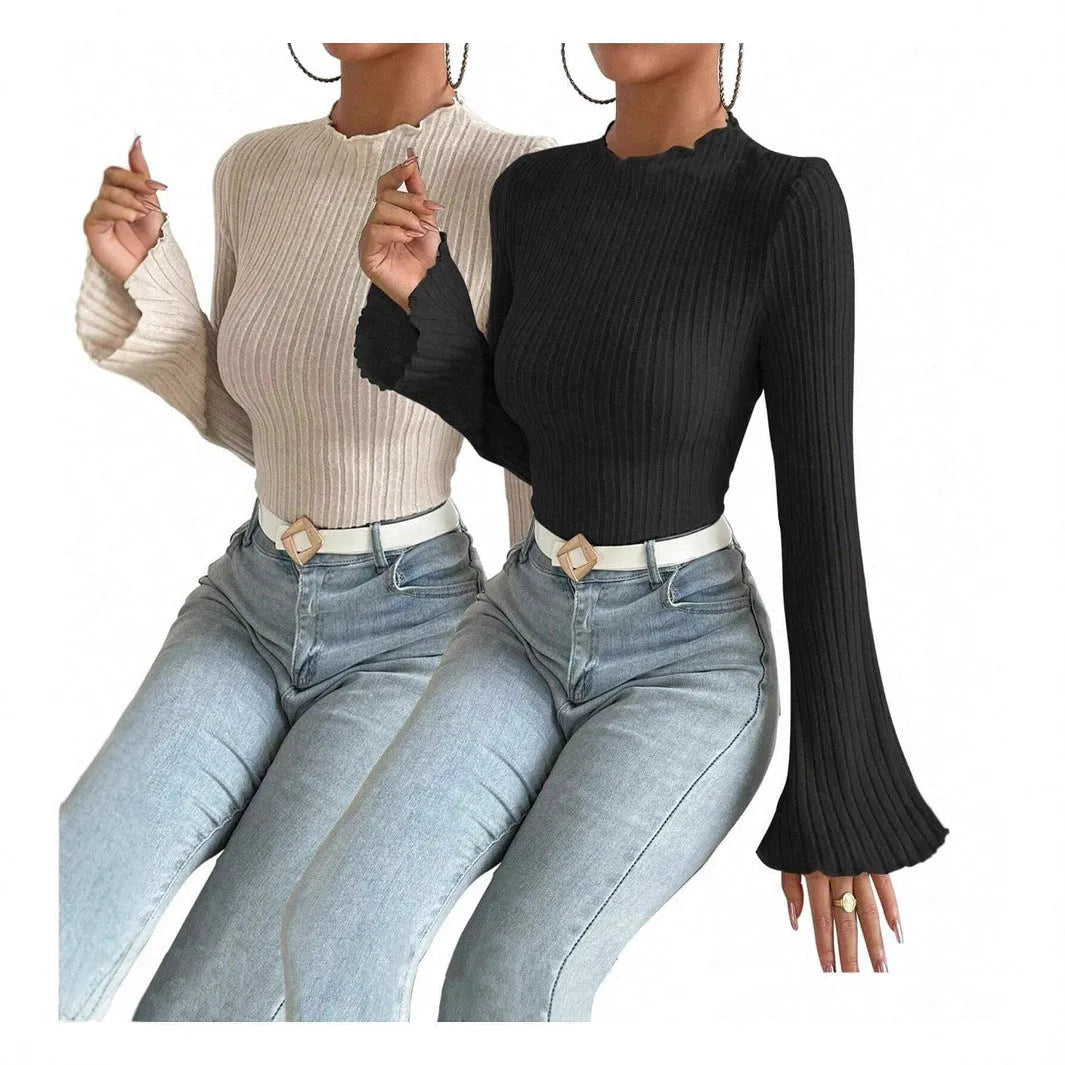 Black slim fit long sleeve top with round neck and lantern sleeves on a mannequin.