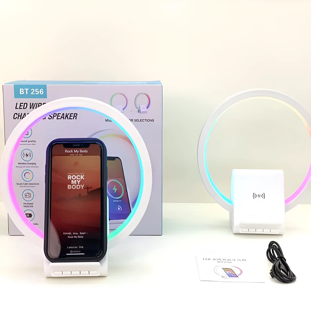White square Bluetooth speaker with integrated wireless charging pad and ambient LED lighting.
