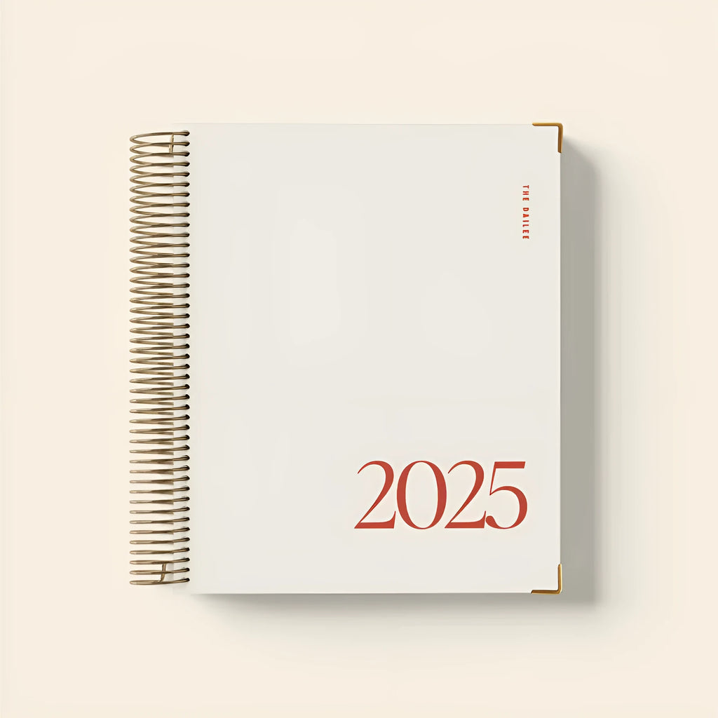 Cherry red coil notebook with spiral binding open to show paper pages